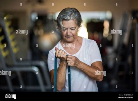 One Mature Woman Doig Exercise At The Gym To Be Healthy And Fitness