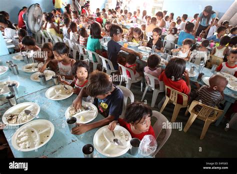 Philippines feeding program hi-res stock photography and images - Alamy