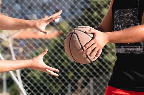 Premium Photo Basketball Players Hands Trying To Steal The Ball