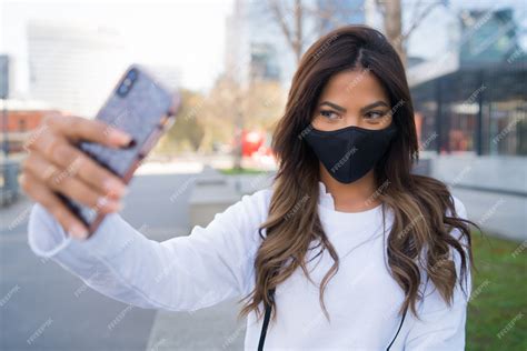 Premium Photo Portrait Of Young Woman Wearing Protective Mask And