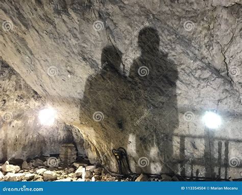 Two Mans Shadows On A Wall In Ialominta Cave Stock Photo Image Of