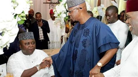 Reactions As Photo Of Adebutus Alleged Scornful Handshake With Gov