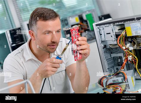 Man Fixing Computer Stock Photo Alamy