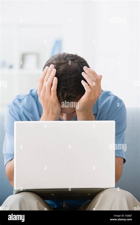 Man With His Head In Hands Stock Photo Alamy