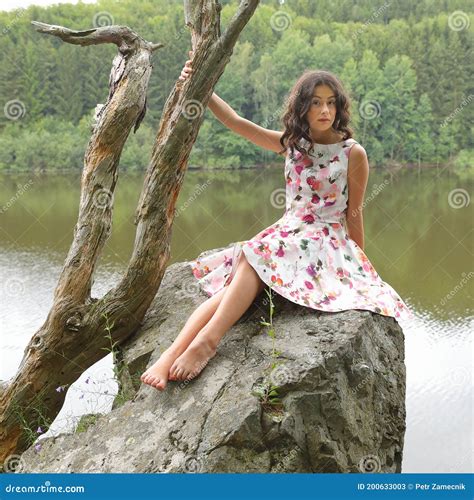 Scared Teenage Girl Sitting On Rock Above River Stock Image Image Of