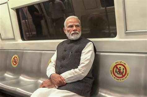 Pm Modi Boards Delhi Metro Interacts With Commuters See Photos Business Gallery News The