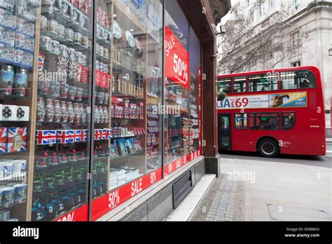 Tourist Souvenirs In London Shop Window With 50 Sale Poster And Double