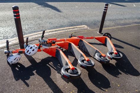 A Row Of Neuron E Scooters For Hire Blown To The Ground On A Windy Day