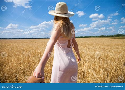 Come with Me, Young Beautiful Girl Holds the Hand of a Man in a Wheat ...