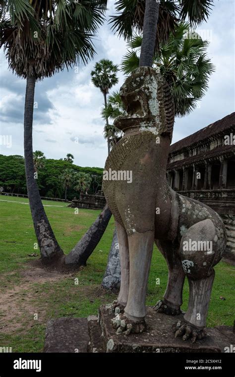 Sculpture Of A Guardian Lion Garden With Palms And Partial View On The