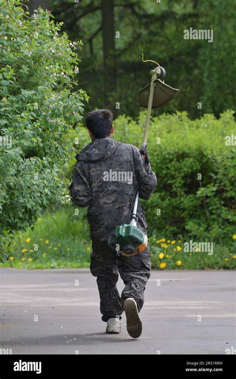 Moscow Russia May Utility Worker Walks Through The Park