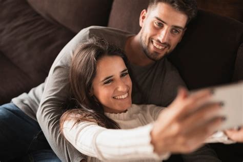 Free Photo Smiley Couple At Home Taking Selfie