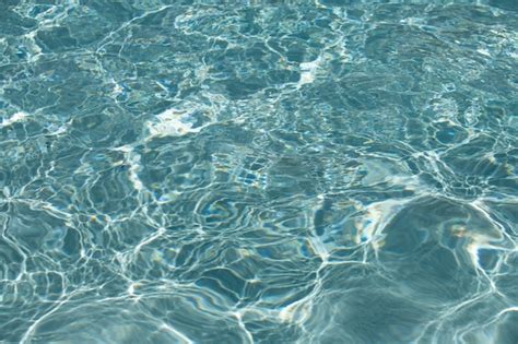 Premium Photo Background Of Blue Water In Swimming Pool With Sun