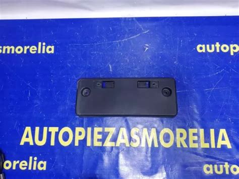 Porta Placas Delantero Nissan Versa Original Bueno Env O Gratis