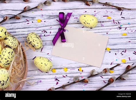 Easter Background With Yellow Easter Eggs Pussy Willow Branches Purple Ribbon And Space For Text