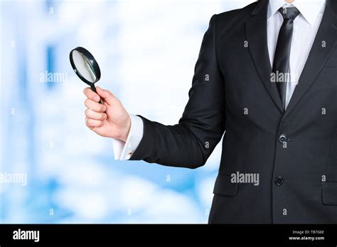 Business Man Holding Magnifying Glass Concept Stock Photo Alamy