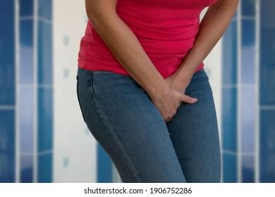 Closeup Woman Hands Holding Her Crotch Stock Photo