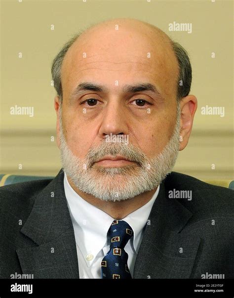 Federal Reserve Board Chairman Ben Bernanke Looks On As Us President