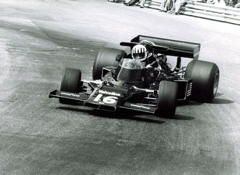 Tom Pryce posing with deerstalker-1974 British GP, Brands Hatch