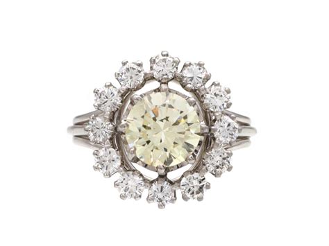 Vintage pale yellow diamond and diamond cluster ring