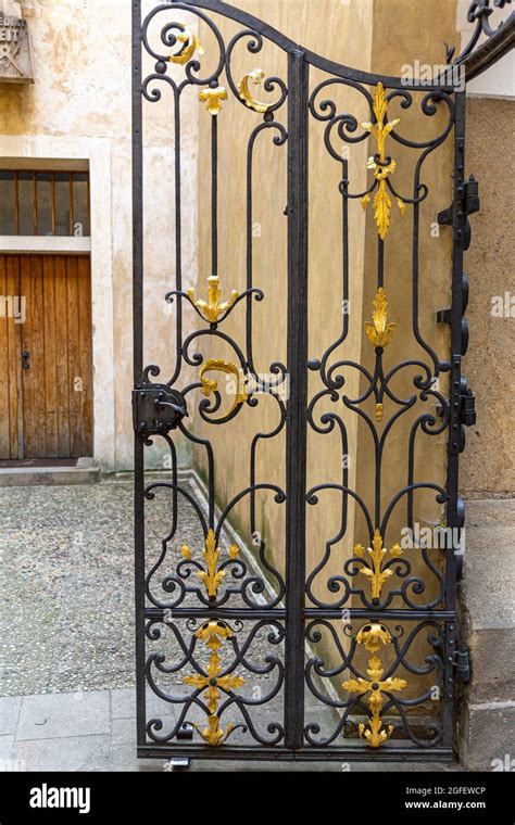 An Old Semi Open Wrought Iron Gate In A Castle Stock Photo Alamy