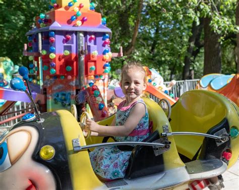 Child Rides In An Amusement Park. Children Attractions Stock Image ...