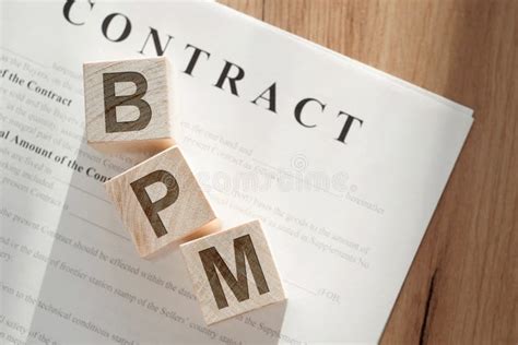 Wooden Cubes With Text BPM Short For Business Process Managementon