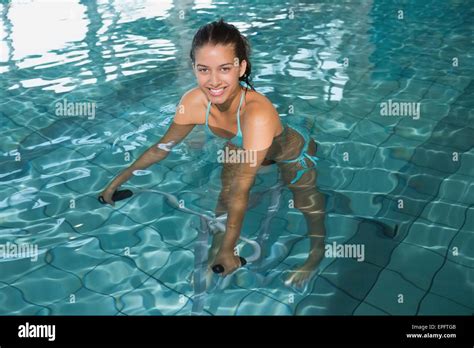 Fit Brunette Using Underwater Exercise Bike Stock Photo Alamy