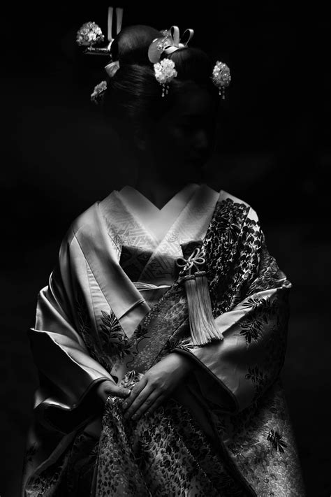 Download Black Background Geisha Wallpaper | Wallpapers.com