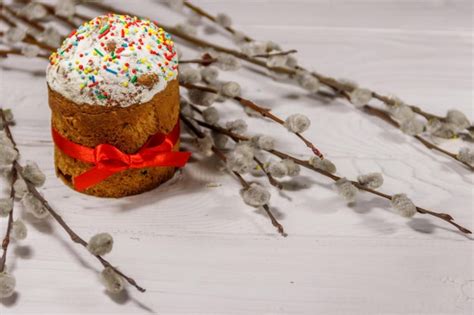 Premium Photo Easter Cakes With Pussy Willow Branches On White Wooden Table