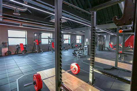 Two Squat Racks Including Olympic And Deadlift Platforms Also Visible