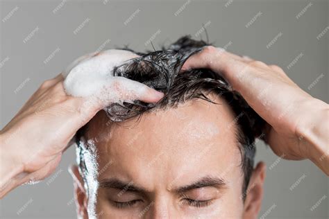 Premium Photo Close Up Man Washing His Hair