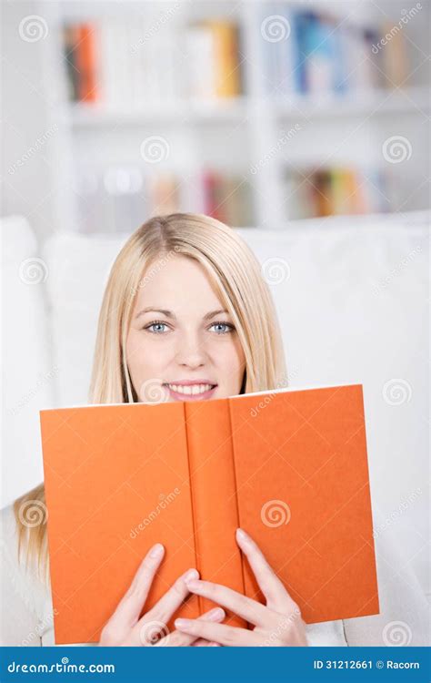 Young Woman Holding Book In Living Room Stock Image Image Of Book