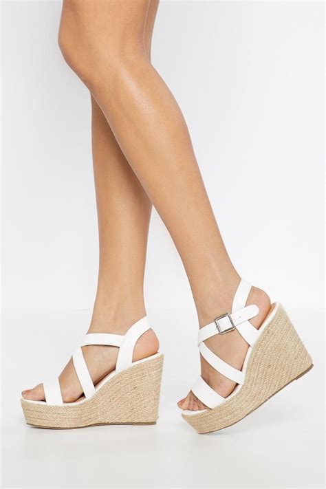 Strappy Days These Wedges Feature A Woven Wedge Heel Faux Leather