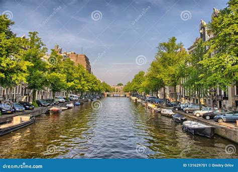 Boats on Amstel River in Amsterdam in Holland, Netherlands, HDR ...