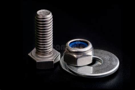 Stainless Steel Bolt with a Nut and Washers on Black Stock Photo ...