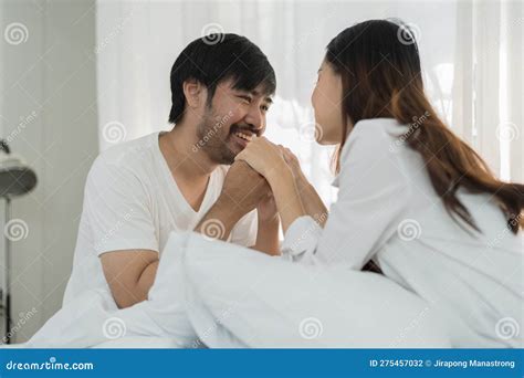 Asian Romantic Couple In Bed Enjoying Sensual Foreplay Happy Sensual Young Couple Lying In Bed