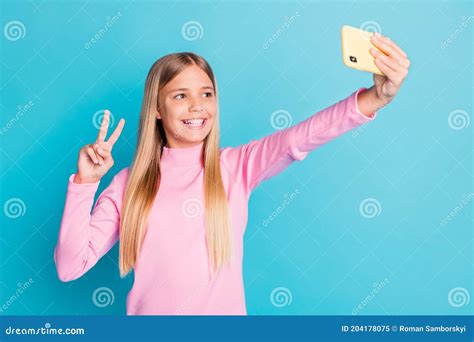 Photo Portrait Of Pretty Female Preteen Taking Selfie Showing V Sign