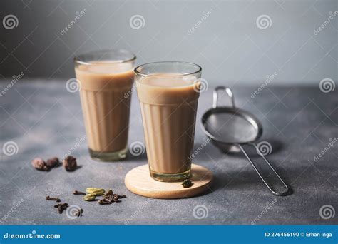 Indian Masala Chai Tea Two Glasses With Traditional Glasses With Strainer And Chai Spices