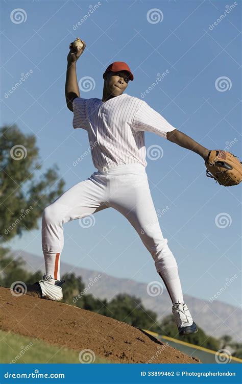 Baseball Pitcher Throwing Ball during Game Stock Photo - Image of springs, looking: 33899462