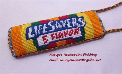 A Colorful Key Chain With The Words Life Saver S Funz On It