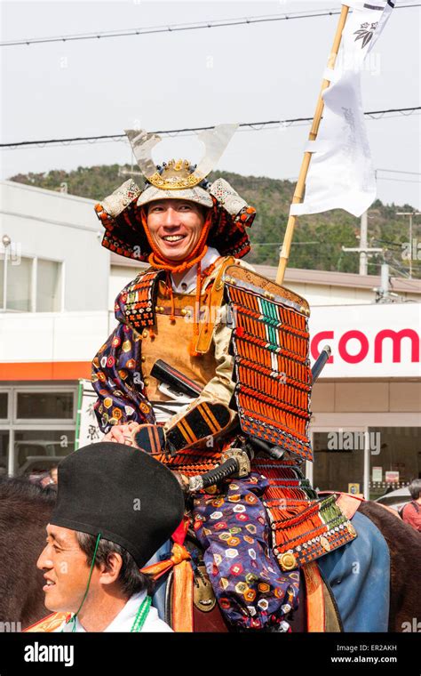 Japanese Man Dressed In Full Samurai Armour On Horseback Smiling At