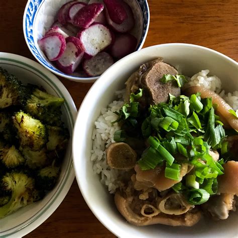 Braised pig feet over rice and oven roasted broccoli and radishes. : r/tonightsdinner