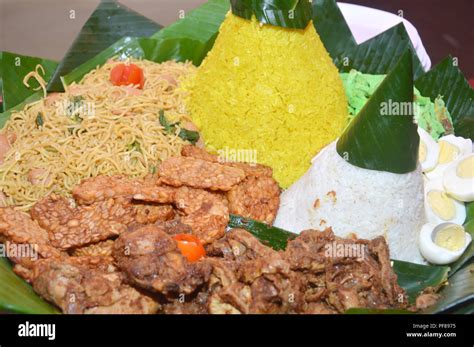 nasi tumpeng, traditional Javanese food, complete food with side dishes Stock Photo - Alamy