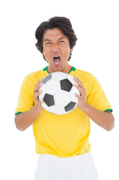 Retrato de un jugador de fútbol gritando Foto Premium