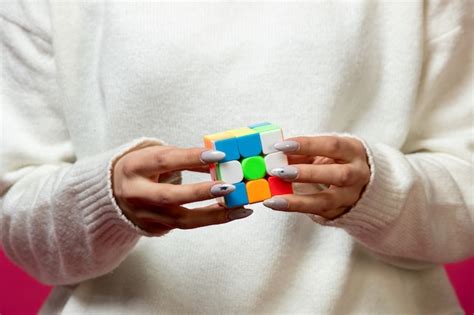 Free Photo Woman Holding Rubik S Cube In Hands