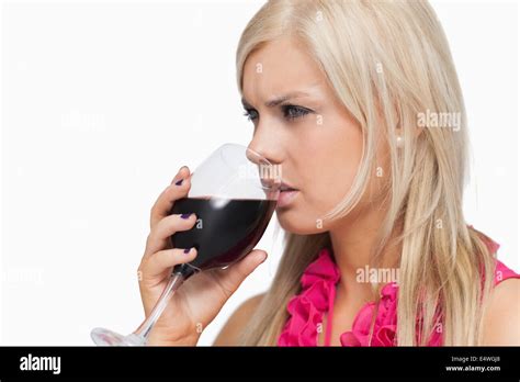 Blonde Drinking A Glass Of Wine Stock Photo Alamy