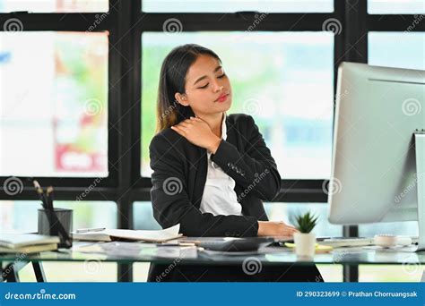 Tired Millennial Businesswoman Massaging Her Neck Feeling Hurt Pain