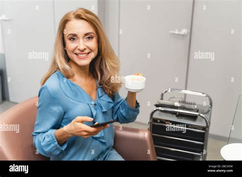 Delighted Blonde Woman Demonstrating Her Friendly Smile Stock Photo Alamy