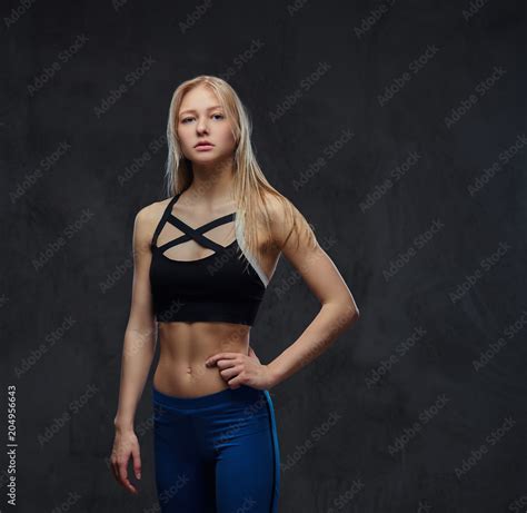Sexy Slim Blonde Girl In A Sportswear Posing In A Studio Stock Photo Adobe Stock